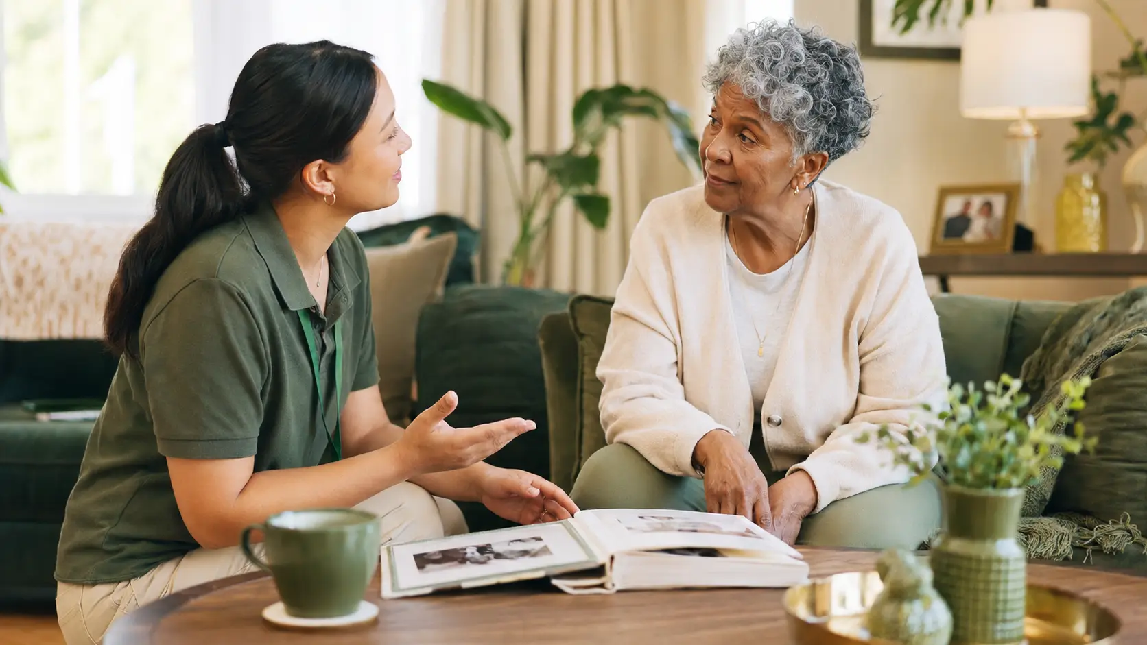 Caregiver communicating respectfully with an older adult living with dementia